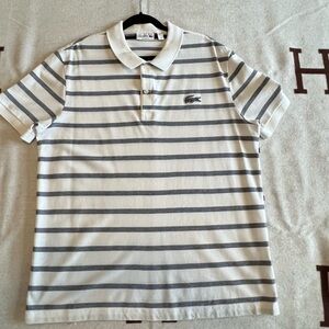 Lacoste White with Black horizontal strips.